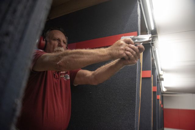 John Deloca, the owner of Seneca Sporting Range, shoots at a target